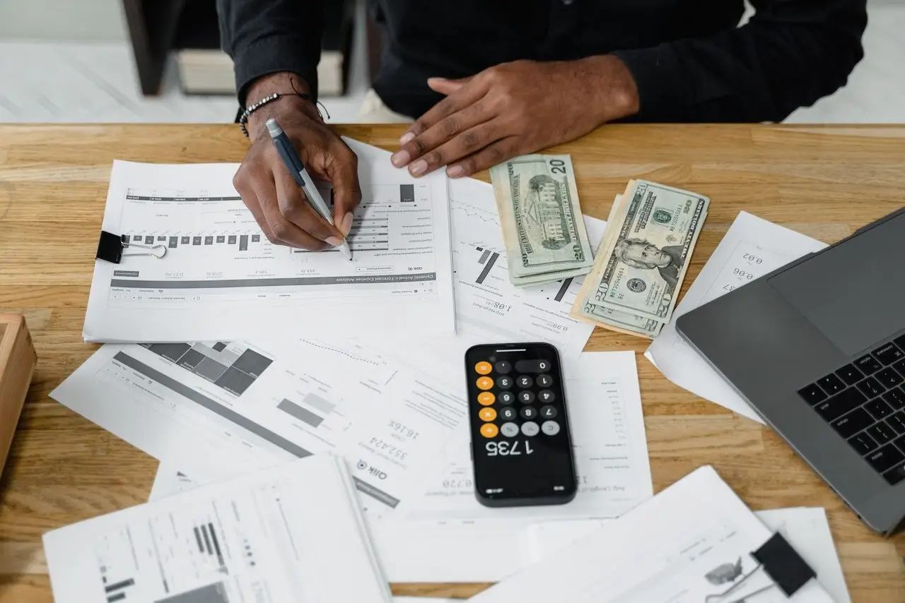 Accountant reviewing financial statements and expense analysis for a contractor